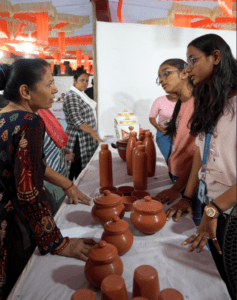 Udaan trade exhibition, best private university in Gujarat, Dr. Subhash University, DSU trade exhibition, student creativity showcase, handcrafted art exhibition, women empowerment through art, kitchen art display, handmade crafts event, innovation and creativity fair, DSU student talent, Gujarat trade exhibition, local artisans support, affordable handmade products, artistic talent promotion, social responsibility event, best university for innovation, community-driven exhibition, student entrepreneurship event, DSU academic excellence 